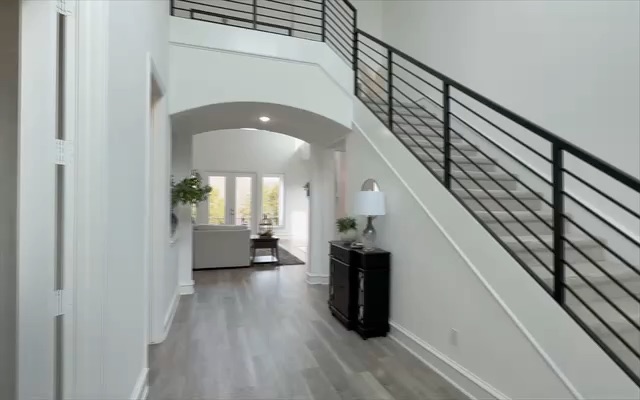 Walking through the entry and dining room of 4571 Lake Breeze Dr, a home I listed and sold, the way a video tour looks