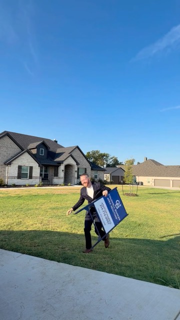 Picking up a yard sign